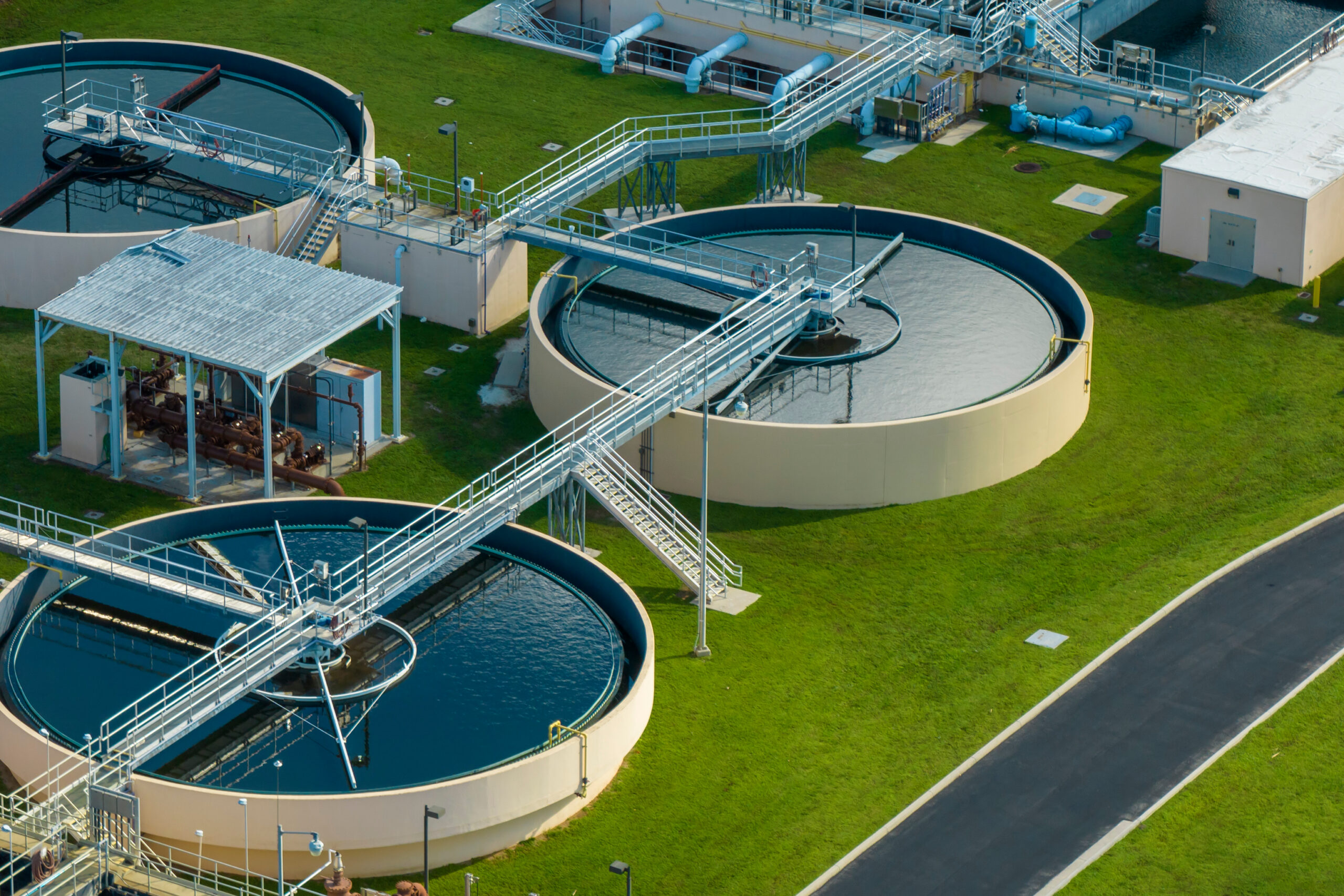 Aerial view of water treatment factory at city wastewater cleaning facility. Purification process of removing undesirable chemicals, suspended solids and gases from contaminated liquid.